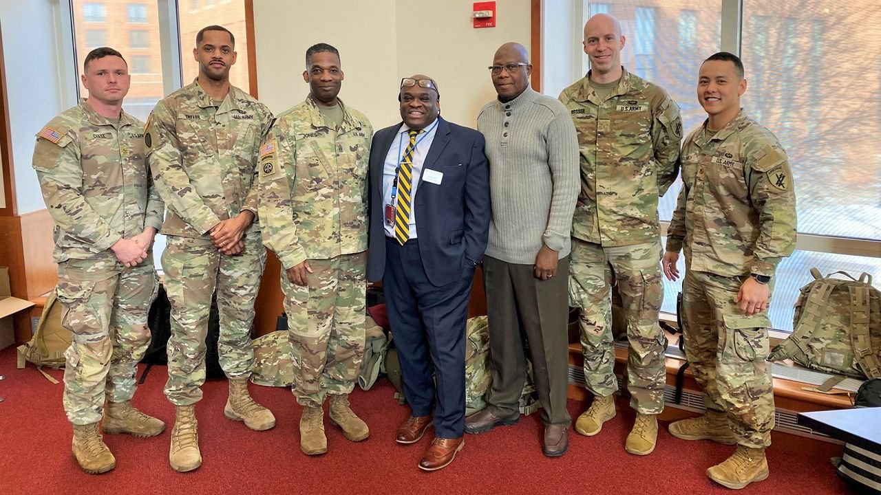 Jacien Carr with U.S. Army personnel at The Ohio State University